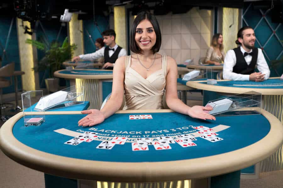 Blackjack dealer with cards on blue table